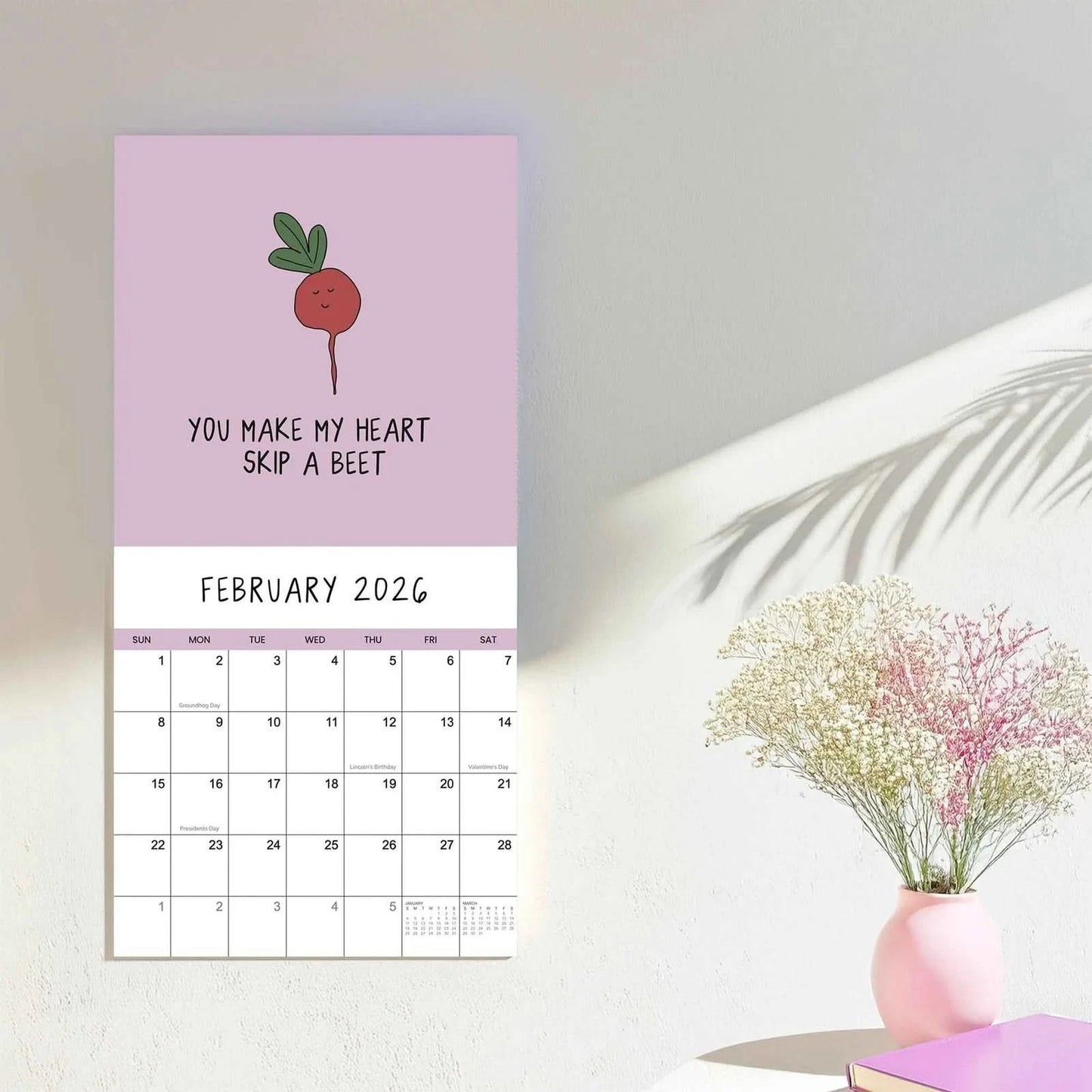 The rockdoodles 2026 wall calendar, "You’ve Got To Be Yolking," is a funny February calendar featuring playful art and wordplay, perfect for hanging by your table.