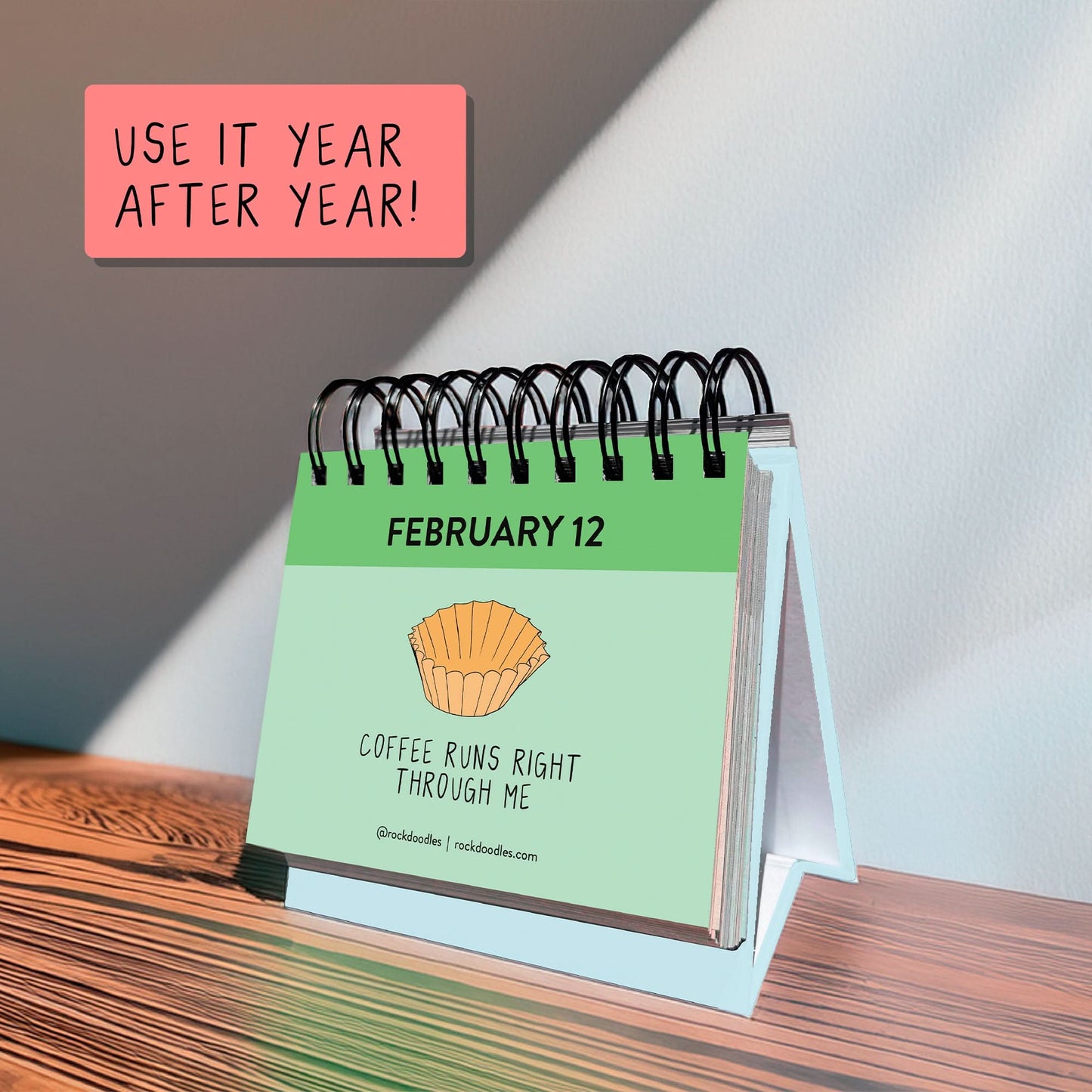 The rockdoodles A Pun A Day Perpetual Calendar shows February 12 with a coffee filter art and "Coffee runs right through me," plus a sticky note: "Use it year after year!"—ideal for fans of daily puns and clever gifts.