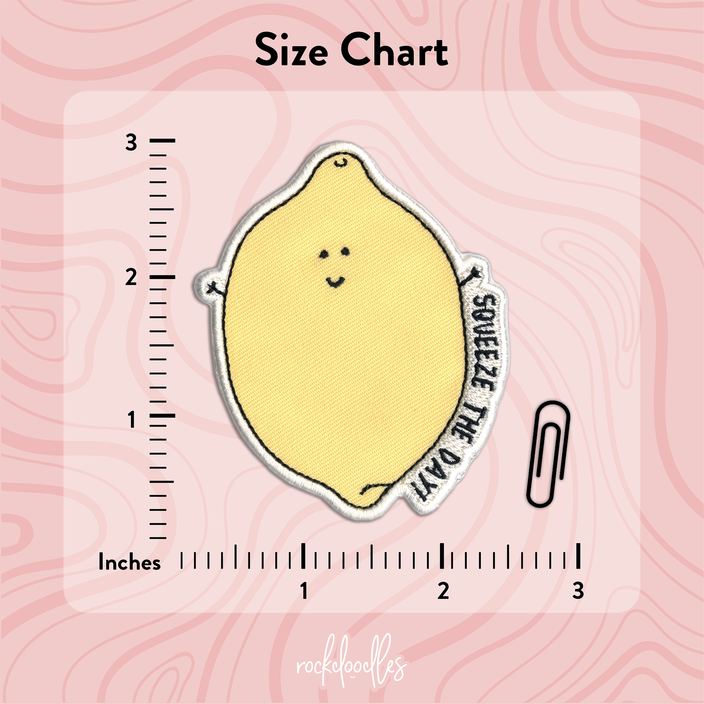A Squeeze The Day Patch with the brand name rockdoodles, suitable for iron-on application with a household iron.