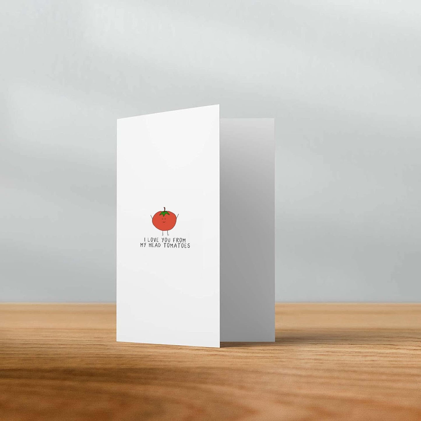 A rockdoodles I Love You From My Head Tomatoes Card enclosed in a plastic sleeve.