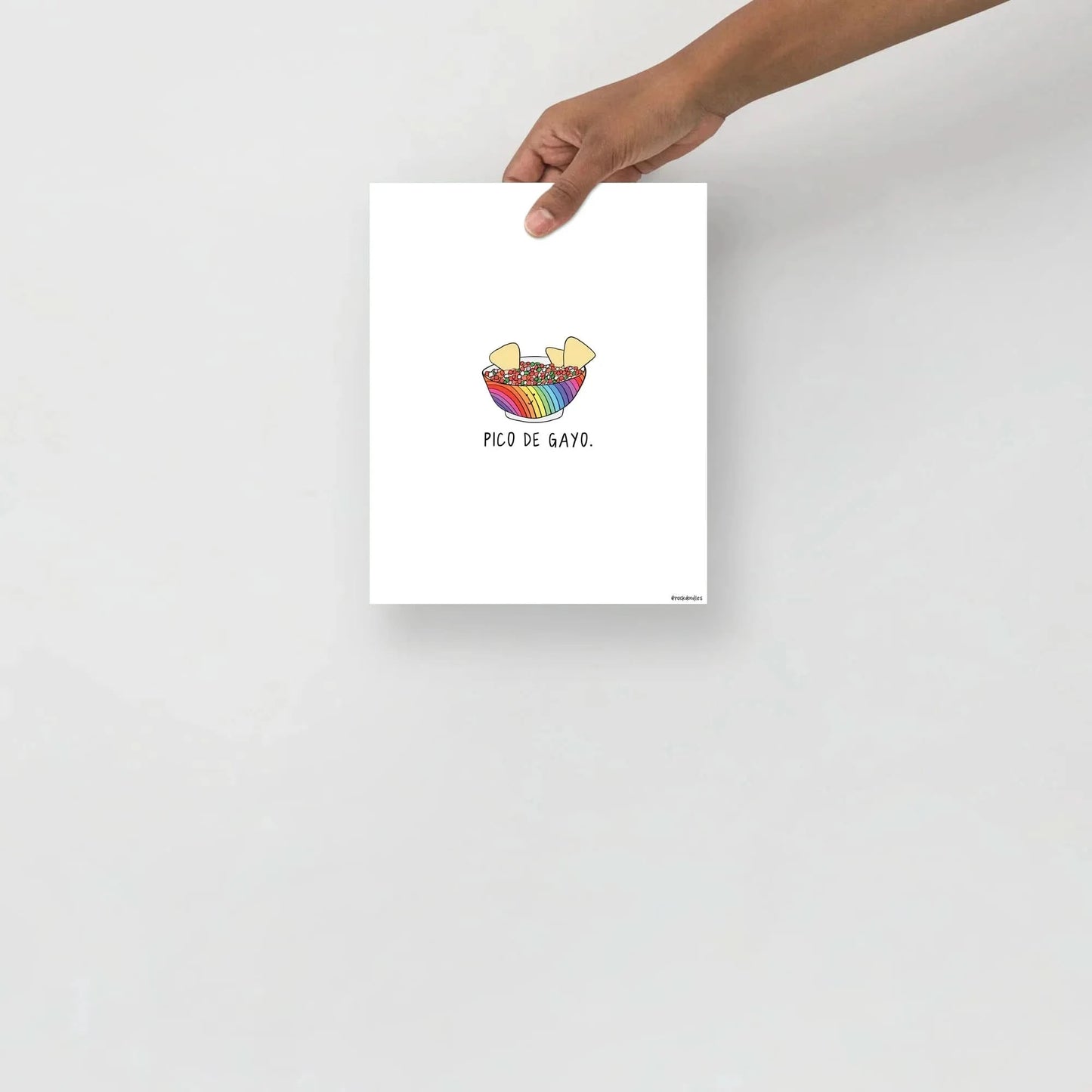 A hand gently cradling a Pico De Gayo Print by rockdoodles on thick matte paper.