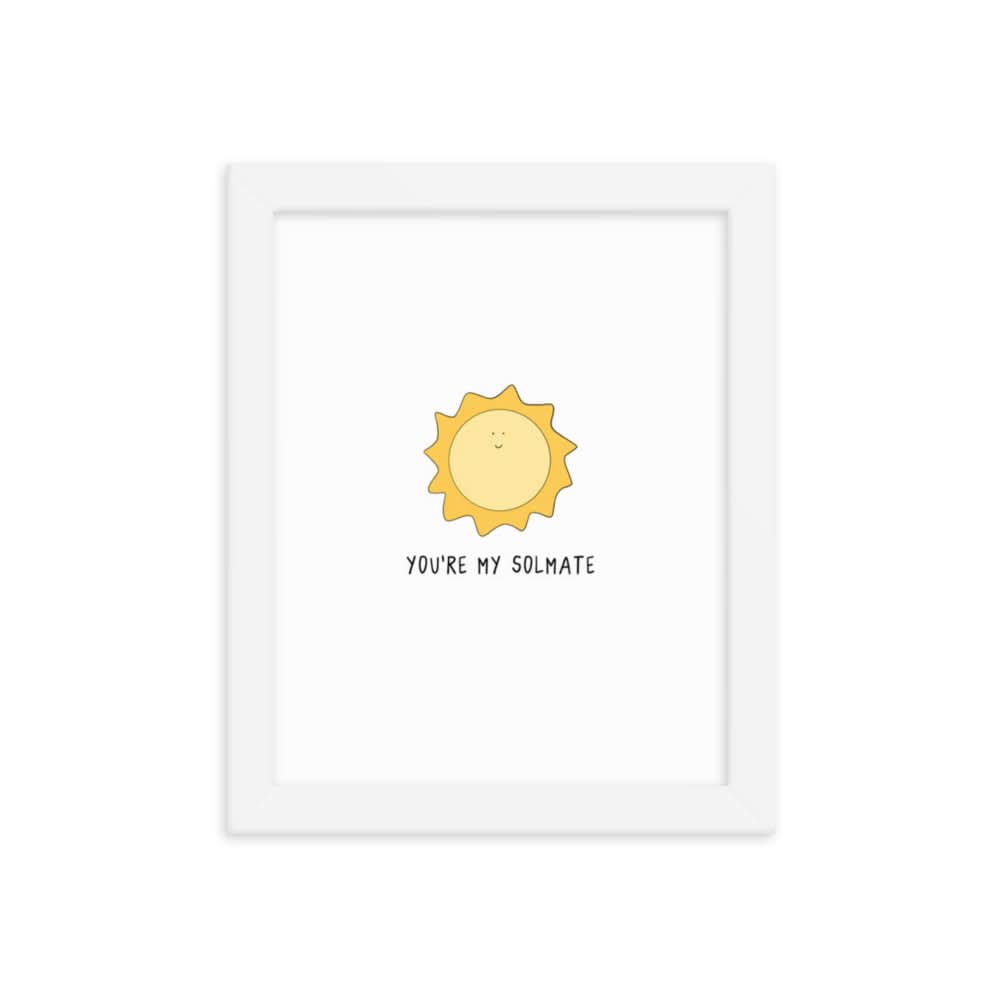 A framed Solmate Print poster of a sun printed on matte paper, encased in a beautiful wood frame. The artwork features the words "peace be with you," brought to you by rockdoodles.