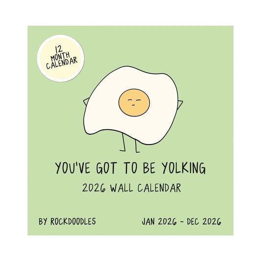 The 2026 Wall Calendar "You've Got To Be Yolking" by rockdoodles features a quirky fried egg with arms and legs on a green cover—a playful, pun-filled gift for fans of the brand's signature style.