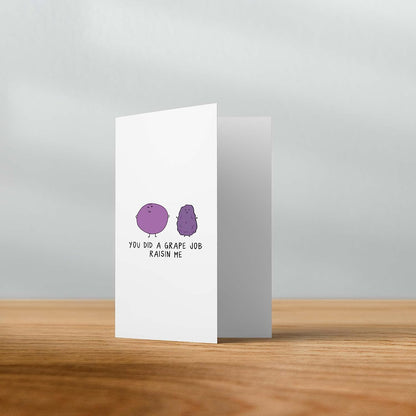A Grape Job Raisin Me Card from rockdoodles adorned with a single purple dot on it.
