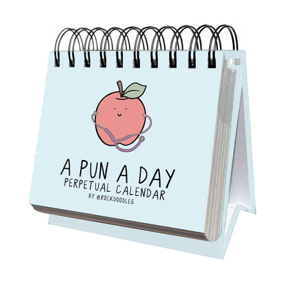 The rockdoodles "A Pun A Day Perpetual Calendar" is a spiral-bound desk calendar with a cover illustration of a smiling peach wearing a stethoscope—perfect for daily pun lovers.