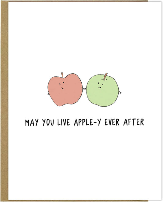 May you live Apple-y Ever After with this charming rockdoodles greeting card. The design features the captivating phrase "May You Live Apple-Y Ever After" in a delightful font. The card is made from eco-friendly materials.