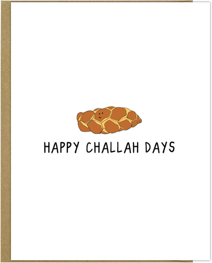 rockdoodles Challah Days Card. This delightful card features the phrase "Happy Challah Days" in bold, festive lettering. It comes with a tastefully designed natural envelope that perfectly complements the rockdoodles brand.