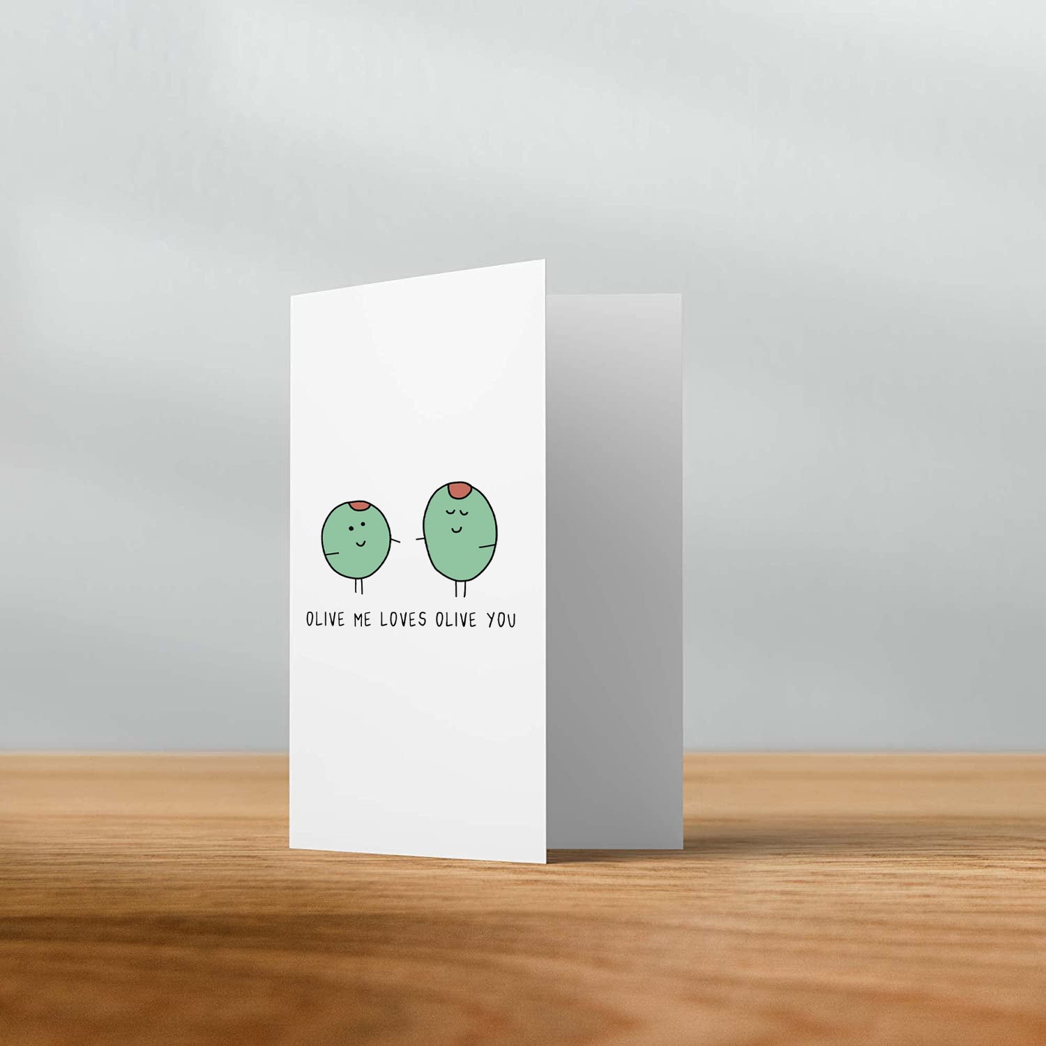 A Olive Me Card with two green birds on it. (Brand Name: rockdoodles)
