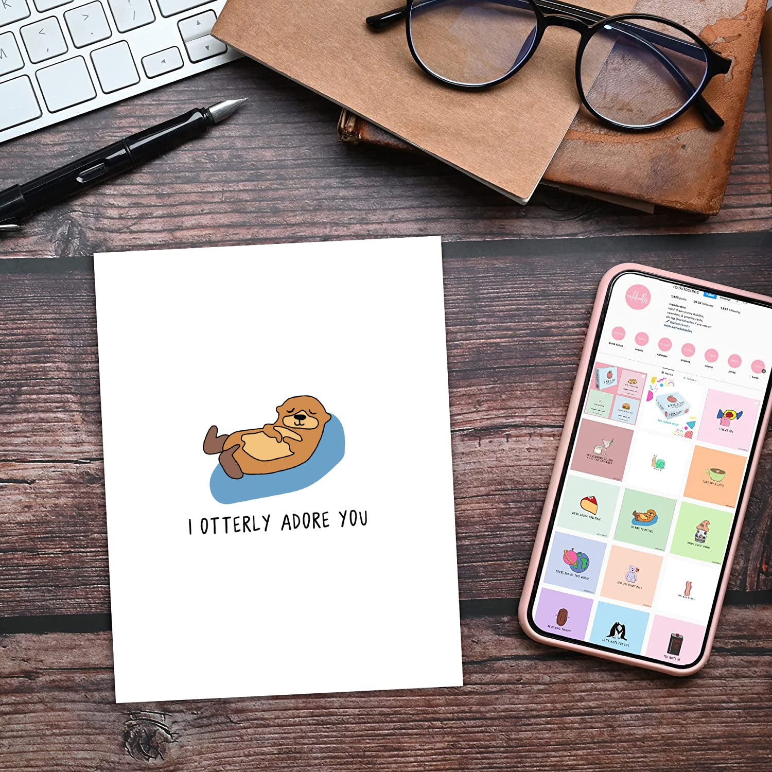 An I Otterly Adore You Card featuring a charming sloth sitting on a desk, perfect for expressing your affection. Brand: rockdoodles